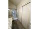 Bathroom showcases a shower-tub combo with marble tile, wood-look tile flooring, and closet storage at 3681 Melonies Dr # 29, Las Vegas, NV 89103