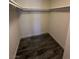 Walk-in closet featuring laminate wood flooring and storage shelves at 3681 Melonies Dr # 29, Las Vegas, NV 89103