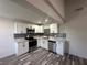 Modern kitchen features stainless steel appliances, granite countertops, and mosaic backsplash at 3681 Melonies Dr # 29, Las Vegas, NV 89103