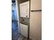 A modern stacked washer and dryer unit in a renovated bathroom at 3681 Melonies Dr # 29, Las Vegas, NV 89103