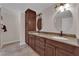 Bathroom featuring dual sinks, granite countertops and custom wood cabinetry at 3753 Meadowcrest Dr, Las Vegas, NV 89121