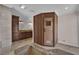 Full bathroom featuring a walk-in shower with a bench, a sauna, and dual sinks at 3753 Meadowcrest Dr, Las Vegas, NV 89121