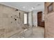 Full bath with tiled walk-in shower including a bench and dual shower heads at 3753 Meadowcrest Dr, Las Vegas, NV 89121