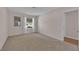 Well-lit bedroom with carpet, large window, bright walls, and view to the outdoors at 3753 Meadowcrest Dr, Las Vegas, NV 89121