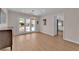 Bright dining area with chandelier lighting and double doors leading to a backyard pool at 3753 Meadowcrest Dr, Las Vegas, NV 89121