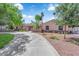 Charming single-story home featuring a circular driveway, mature trees, and well-maintained landscaping at 3753 Meadowcrest Dr, Las Vegas, NV 89121