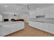 Open-concept kitchen features white cabinetry and a large island at 3753 Meadowcrest Dr, Las Vegas, NV 89121