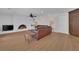 Spacious living room with a painted brick fireplace and modern flooring at 3753 Meadowcrest Dr, Las Vegas, NV 89121