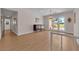 Bright living room with chandelier and view to a landscaped backyard at 3753 Meadowcrest Dr, Las Vegas, NV 89121