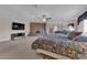 Large main bedroom with a brick fireplace, ceiling fan, TV and mirrored closet at 3753 Meadowcrest Dr, Las Vegas, NV 89121