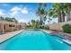 Inviting backyard pool surrounded by lush landscaping and a privacy wall at 3753 Meadowcrest Dr, Las Vegas, NV 89121