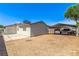 Backyard featuring additional carport parking with a desert landscape at 4168 Wendy Ln, Las Vegas, NV 89115