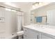 Bathroom featuring white quartz countertop and tiled shower at 4168 Wendy Ln, Las Vegas, NV 89115