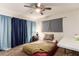 Comfortable bedroom with ceiling fan and carpet at 4168 Wendy Ln, Las Vegas, NV 89115