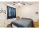 Cozy bedroom featuring a ceiling fan and natural light from a window at 4168 Wendy Ln, Las Vegas, NV 89115
