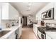 Spacious kitchen with quartz countertops, stainless appliances, and casual dining area at 4168 Wendy Ln, Las Vegas, NV 89115