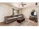 Comfortable living room with sectional sofa, neutral rug, and a ceiling fan at 4168 Wendy Ln, Las Vegas, NV 89115