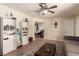 Comfortable living room with sectional sofa, neutral rug, and a ceiling fan at 4168 Wendy Ln, Las Vegas, NV 89115