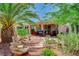 Backyard features a maturely landscaped yard with desert plants, patio and outdoor seating at 4174 Cascada Piazza Ln, Las Vegas, NV 89135