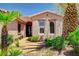 Up close view of single story stucco home with manicured landscaping at 4174 Cascada Piazza Ln, Las Vegas, NV 89135