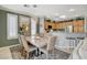 Charming kitchen with a dining table, complete with wooden cabinets and a stainless-steel refrigerator at 4174 Cascada Piazza Ln, Las Vegas, NV 89135