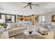 Living area with tile floors, crown molding, shutters, and an eat-in kitchen at 4174 Cascada Piazza Ln, Las Vegas, NV 89135