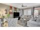 Comfortable living room with a plush sofa, decorative art, and a view of the outdoor patio at 4174 Cascada Piazza Ln, Las Vegas, NV 89135