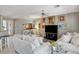 Bright and airy living room with neutral paint, tile floors, and ample seating at 4174 Cascada Piazza Ln, Las Vegas, NV 89135