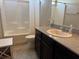 Bathroom features a double vanity and glass enclosed shower offering modern elegance at 4337 Stardusk Falls Ave, North Las Vegas, NV 89084