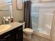Modern bathroom featuring a shower, granite counters and modern fixtures at 4337 Stardusk Falls Ave, North Las Vegas, NV 89084
