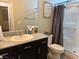 Modern bathroom featuring a shower, granite counters and modern fixtures at 4337 Stardusk Falls Ave, North Las Vegas, NV 89084