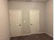 Bedroom features neutral paint and carpeting, with two doors to maximize privacy at 4337 Stardusk Falls Ave, North Las Vegas, NV 89084
