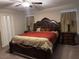 Bedroom features a decorative bed with a ceiling fan and accent lighting for a luxurious experience at 4337 Stardusk Falls Ave, North Las Vegas, NV 89084