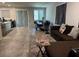 Open-concept living room offers a seamless flow into the dining area and kitchen at 4337 Stardusk Falls Ave, North Las Vegas, NV 89084