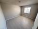 A bedroom with tile flooring and a window to let in sunlight at 435 Mesa Blvd # 202, Mesquite, NV 89027
