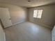 Bright bedroom features modern tile flooring and neutral paint, creating a serene and inviting atmosphere at 435 Mesa Blvd # 202, Mesquite, NV 89027