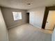 This bedroom features neutral walls, tile flooring, and a window with outside views at 435 Mesa Blvd # 202, Mesquite, NV 89027