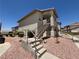 The exterior showcases stairs to upper units and desert landscaping at 435 Mesa Blvd # 202, Mesquite, NV 89027