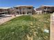 Exterior of the condo with lush green grass at 435 Mesa Blvd # 202, Mesquite, NV 89027