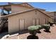 Exterior view of the condos with multiple storage units near well-maintained landscaping at 435 Mesa Blvd # 202, Mesquite, NV 89027