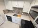 Close up showcasing the kitchen's granite countertop and stainless-steel appliances at 435 Mesa Blvd # 202, Mesquite, NV 89027