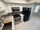 Kitchen featuring white cabinets, stainless steel appliances, and a modern backsplash at 435 Mesa Blvd # 202, Mesquite, NV 89027