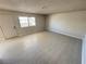 Cozy living room is filled with natural light and has access to the front door at 435 Mesa Blvd # 202, Mesquite, NV 89027