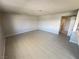 Spacious living room with neutral walls and tile flooring offers a clean, open space at 435 Mesa Blvd # 202, Mesquite, NV 89027