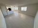 Open living area features a ceiling fan, natural light, and seamless flow to the kitchen at 435 Mesa Blvd # 202, Mesquite, NV 89027
