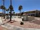 Community pool area with palm trees, lounge chairs, and well-maintained landscaping at 435 Mesa Blvd # 202, Mesquite, NV 89027