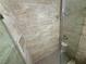 Shower with glass door, tiled walls and flooring at 435 Mesa Blvd # 202, Mesquite, NV 89027