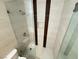 Walk-in shower with sleek glass doors, neutral tile, and convenient shelving at 435 Mesa Blvd # 202, Mesquite, NV 89027