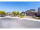 Attractive single-story home featuring a stone facade and manicured landscaping at 4376 Latitude Valley Ct, North Las Vegas, NV 89084