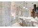Stylish bathroom featuring a glass shower, soaking tub, double sinks, and marble accents at 4381 W Flamingo Rd # 1512, Las Vegas, NV 89103
